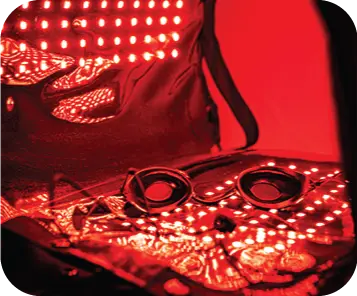 Protective goggles resting on the red light pad