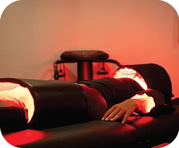 Client resting during a red light session at WellFit NJ
